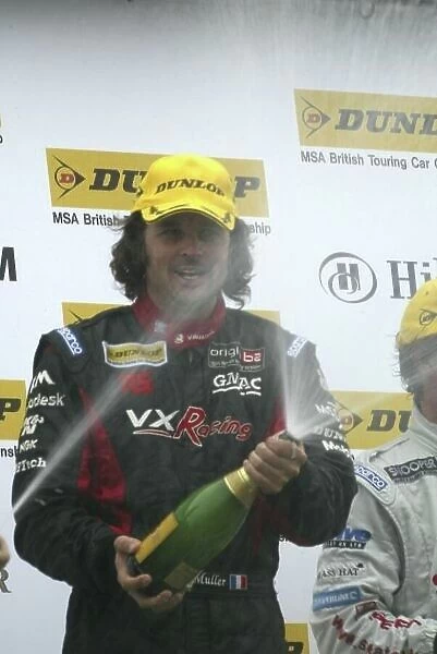 2005 Dunlop MSA British Touring Car Championship Mondello, Ireland. 23rd - 24th July. Yvan Muller, (VX Racing Vauxhall Astra Sport Hatch) celebrates his victory on the podium. World Copyright: Alastair Staley / LAT Photographic Ref: Digital Image Only