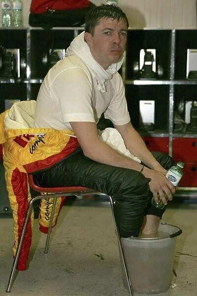 2005 FIA GT Championship Imola, Italy. 28th - 29th May 2005 Belloc (No. 3 Ferrari 575 Maranello GTC) cools his feet after his stint in the car. World Copyright: Photo4 / LAT Photographic ref: Digital Image Only