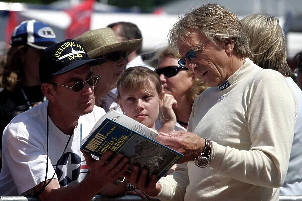 2005 Goodwood Festival of Speed Goodwood Estate, West Sussex. 24th - 26th June. Derek Bell meets a fan. Portrait. World Copyright: Gary Hawkins / LAT Photographic ref: Digital Image Only