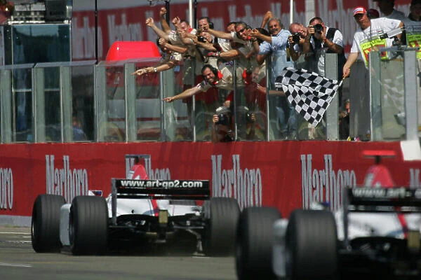 2005 GP2 Series - Hungary Hungaroring, Budapest 28th - 31st July 2005 Sunday Race2 Winner Alexandre Premat (F, ART Grand Prix) 1st, leads Nico Rosberg (D, ART Grand Prix) 2nd across the finish line to the cheers and celebrations of their teams