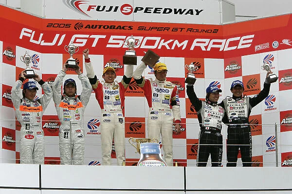 2005 Japanese GT Championship Fuji, Japan. 4th May 2005 GT300 Podium - winners Haruki Kurosawa  /  Shinya Hosokawa (Ebbro M-Tec NSX) 1st, Morio Nitta  /  Shinichi Takagi (ARTA Garaiya) 2nd and Kota Sasaki  /  Tetsuya Tanaka (Reckless MR-S) 3rd