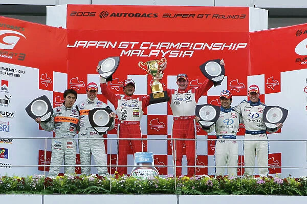 2005 Japanese Super GT Championship Sepand, Malaysia. 26th June 2005 GT500 podium - winners Richard Lyons and Satoshi Motoyama (Xanavi Nismo Z) 1st, Daisuke Ito / Ralph Firman (Arta NSX) 2nd and Takeshi Tsuchiya / James Courtney (TOM's Supra) 3rd
