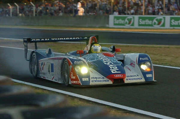 2005 Le Mans 24 Hours Le Mans, France. 17th - 18th June Franck Montagny (F) / Jean-Marc Gounon (F) / Stephane Ortelli (F) (no 4 Audi R8, Audi Playstation Team ORECA) comes into the pits with a tyre problem. Action
