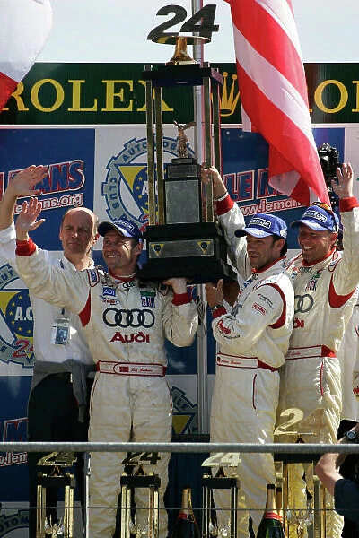 2005 Le Mans 24 Hours Le Mans, France. 17th - 18th June JJ Lehto (FIN) / Marco Werner (D) / Tom Kristensen (D) (no 3 Audi R8, Champion Racing) the trophy. World Copyright: Peter Spinney / LAT Photographic Ref: Digital image only