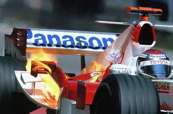 2005 Spanish Grand Prix Barcelona, Spain. 6th - 8th May 2005 Jarno Trulli's Toyota TF105, blasts out a ball of fire, as he exits the pits after a routine stop. He would carry on to finish 3rd