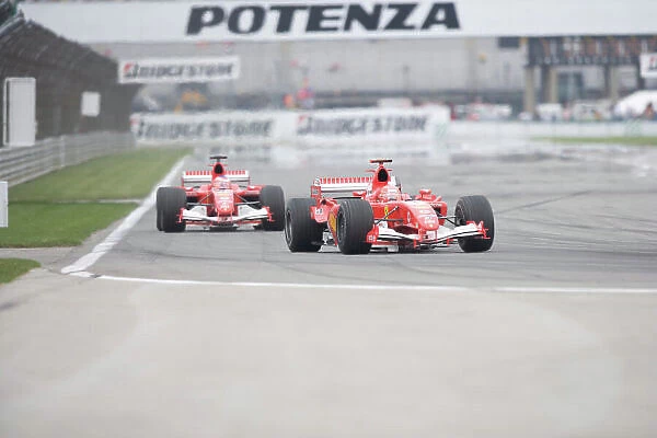2005 United States Grand Prix - Sunday Race, Indianapolis, USA. 19th June 2005 Michael Schumacher, Ferrari F2005 team mate Rubens Barrichello, Ferrari F2005, run in 1st and 2nd formation, during the 6 car race