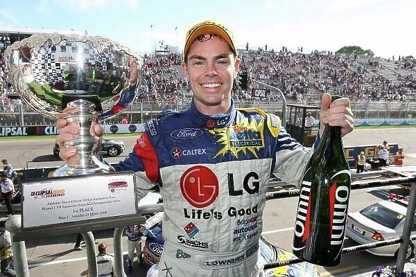 2006 Australian V8 Supercars Clipsall 500, Adelaide, Australia. 25th - 26th March 2006. Race One winner Craig Lowndes (Team Betta Electrical Ford Falcon BA) with champagne and trophy. World Copyright: Mark Horsburgh / LAT Photographic ref