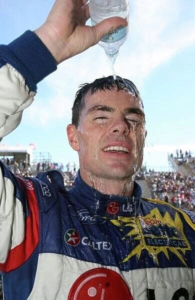 2006 Australian V8 Supercars Clipsall 500, Adelaide, Australia. 25th - 26th March 2006. Race One winner Craig Lowndes (Team Betta Electrical Ford Falcon BA) cools off with a bottle of water. World Copyright: Mark Horsburgh / LAT Photographic ref