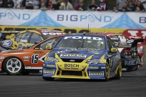 2006 Australian V8 Supercars Queensland Raceway, Australia. 22nd - 23rd July 2006 James Courtney (Stone Brothers Racing Ford Falcon BA) races as Rick Kelly (Toll HSV Dealer Team Holden Commodore VZ)