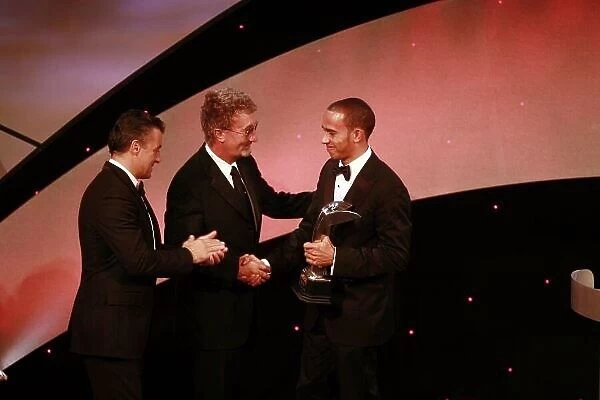 2006 Autosport Awards Grosvenor House Hotel, London. 3rd December 2006. Lewis Hamilton receives the autosport.com Rookie of the Year award from Jean Alesi and Eddie Jordan. World Copyright: Malcolm Griffiths / LAT Photographic ref