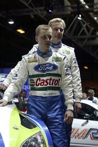 2006 Autosport International Exhibition Birmingham NEC, Thursday 12th January 2006. Mikko Hirvonen and co-driver Jarmo Lehtinen pose with their new car. World Copyright: Malcolm Griffiths / LAT Photographic ref: Digital Image Only