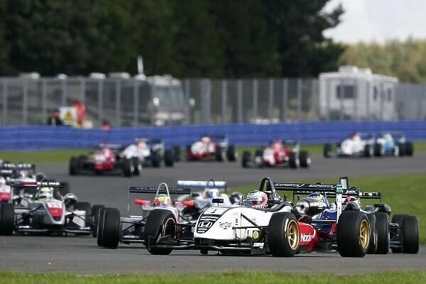 2006 British Formula Three Championship. Silverstone, England. 23rd - 24th September. Christian Bakkerud, (Carlin Motorsport) and the field at the start of the race. Action. World Copyright: Drew Gibson / LAT Photographic. Ref: Digital Image Only