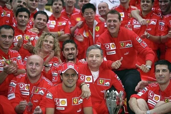 2006 Chinese Grand Prix - Sunday Race Shanghai International Circuit, Shanghai, China. 28th September - 1st October 2006. Michael Schumacher, Ferrari 248F1, 1st position, celebrates his 91st win with the whole team after the race