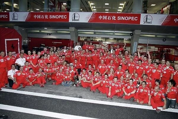 2006 Chinese Grand Prix - Sunday Race Shanghai International Circuit, Shanghai, China. 28th September - 1st October 2006. Michael Schumacher, Ferrari 248F1, 1st position, celebrates his 91st win with the whole team, in a group photo