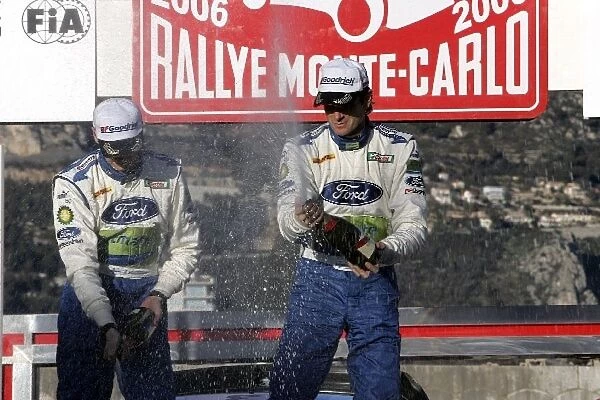 2006 FIA World Rally Championship: R-L: Marcus Gronholm and Timo Rautiainen, Ford, celebrate on the podium