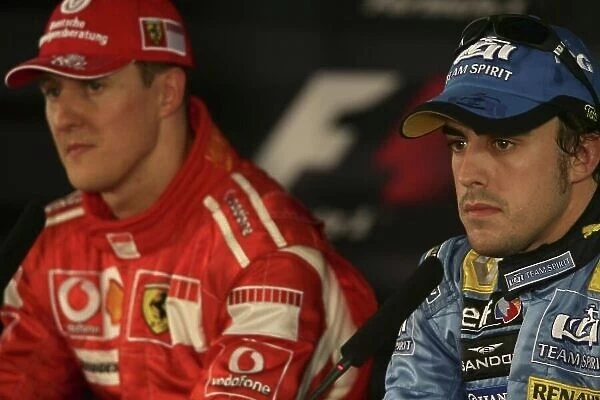 2006 French Grand Prix - Saturday Qualifying Circuit Nevers de Magny Cours, France. 13th - 16th July. Post qualifying press conference - Michael Schumacher, Ferrari 248 F1. (pole position) with Fernando Alonso, Renault R26