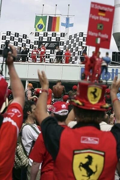 2006 German Grand Prix - Sunday Race Hockenheim, Germany. 27th - 30th July. Ferrari fans get a good view of the podium. World Copyright: Charles Coates / LAT Photographic ref: Digital Image ZK5Y2445