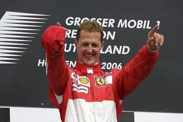 2006 German Grand Prix - Sunday Race Hockenheim, Germany. 27th - 30th July. Michael Schumacher (1st position), Ferrari, celebrates on the podium. World Copyright: Lorenzo Bellanca / LAT Photographic ref: Digital Image ZD2J2076