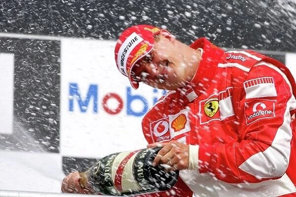 2006 German Grand Prix - Sunday Race Hockenheim, Germany. 27th - 30th July. Michael Schumacher (1st position), Ferrari, celebrates on the podium. World Copyright: Lorenzo Bellanca / LAT Photographic ref: Digital Image ZD2J2123
