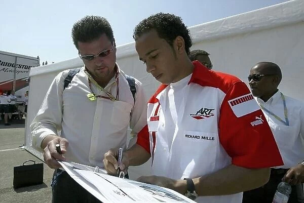2006 GP2 Series. Round 2. Imola Autodromo Enzo e Dino Ferrari, Italy.21st April 2006. Saturday Race. Lewis Hamilton (GBR, ART Grand Prix) signs his autograph.Portrait