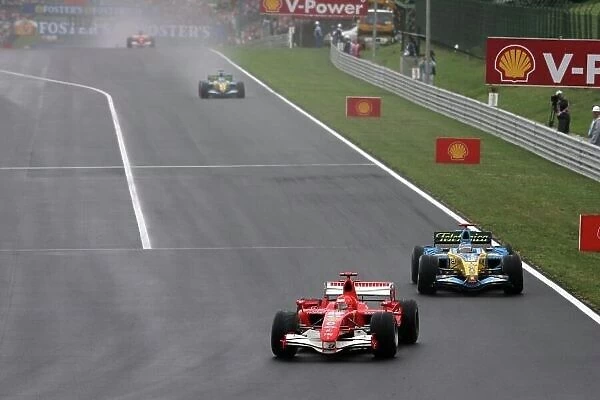 2006 Hungarian Grand Prix - Sunday Race Hungaroring, Budapest, Hungary. 3rd - 6th August. Michael Schumacher, Ferrari 248F1, 8th position, leads Fernando Alonso, Renault R26, retired
