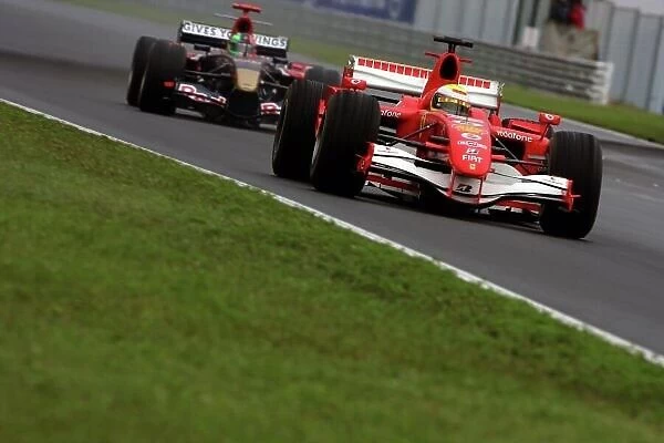 2006 Hungarian Grand Prix - Sunday Race Hungaroring, Budapest, Hungary. 3rd - 6th August. Felipe Massa, Ferrari 248F1, 7th position, leads Vitantonio Liuzzi, Toro Rosso STR01-Cosworth, retired