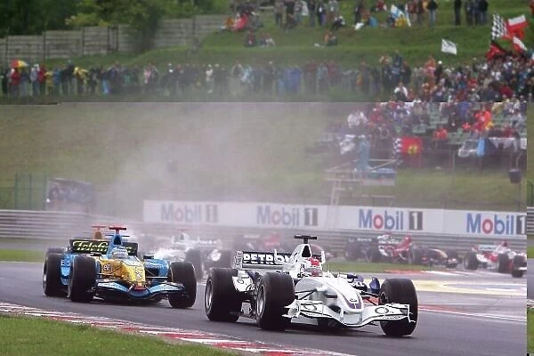 2006 Hungarian Grand Prix - Sunday Race Hungaroring, Budapest, Hungary. 3rd - 6th August. Robert Kubica, Sauber F1.06-BMW, disqualified, leads Fernando Alonso, Renault R26, retired, and the rest of the field