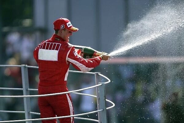 2006 Italian Grand Prix - Sunday Race Autodromo Nazionale Monza, Italy. 7th - 10th September 2006. Michael Schumacher, Ferrari 248F1, 1st position, celebrates on the podium