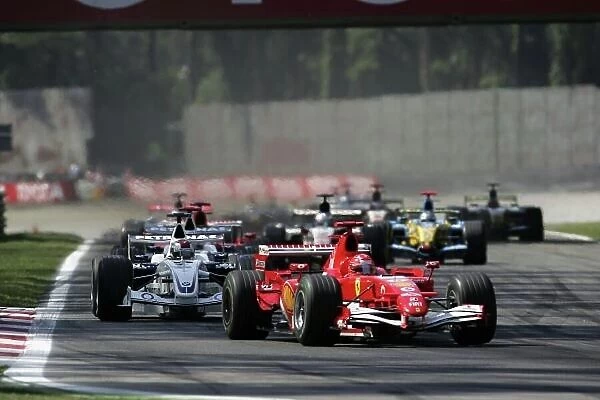 2006 Italian Grand Prix - Sunday Race Autodromo Nazionale Monza, Italy. 7th - 10th September 2006. Michael Schumacher, Ferrari 248F1, 1st position, leads Nick Heidfeld, Sauber F1.06-BMW, 8th position, and the field at the start