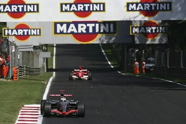 2006 Italian Grand Prix - Sunday Race Autodromo Nazionale Monza, Italy. 7th - 10th September 2006. Kimi Raikkonen, McLaren MP4 / 21-Mercedes-Benz, 2nd position, leads Michael Schumacher, Ferrari 248F1, 1st position