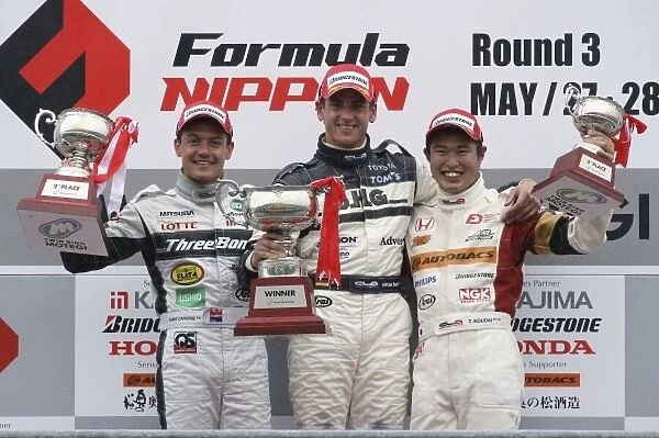 2006 Japanese Formula Three Championship Twin-Ring Motegi, Japan. 28th May 2006 Round 6 podium - winner Adrian Sutil (dallara F305) 1st position, Fabio Carbone (Dallarta F305) 2nd position and Kodai Tsukakoshi (Dome F107) 3rd position