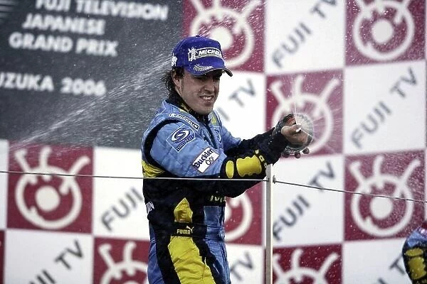 2006 Japanese Grand Prix - Sunday Race Suzuka, Japan. 5th - 8th October 2006 Fernando Alonso, Renault R26, 1st position, celebrates on the podium. World Copyright: Charles Coates / LAT Photographic. ref: Digital Image ZK5Y8162