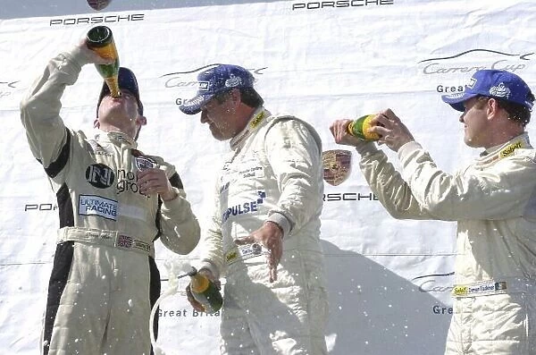 2006 Porsche Carrera Cup Great Britain. Mondello Park, Ireland. 22nd - 23rd April 2006. Sunday Race. Tim Harvey, (Motorbase Performance) celebrates victory on the podium with Damien Faulkner, (Team Parker with SAS) and Danny Watts