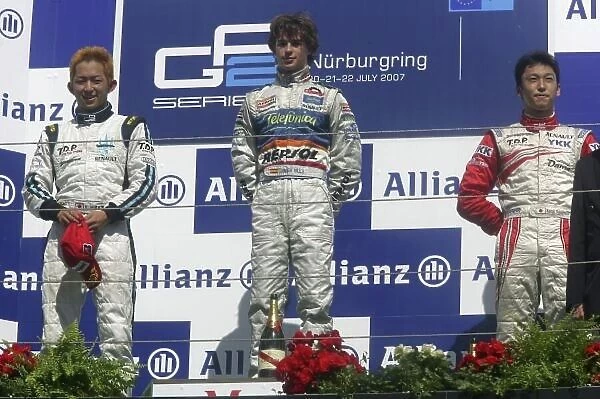 2007 GP2 Series. Round 6. Nurburgring, Germany. 22nd July 2007. Sunday Race. Javier Villa (ESP, Racing Engineering) celebrates victory on the podium with Kohei Hirate (JPN, Trident Racing) and Kazuki Nakajima (JAP)