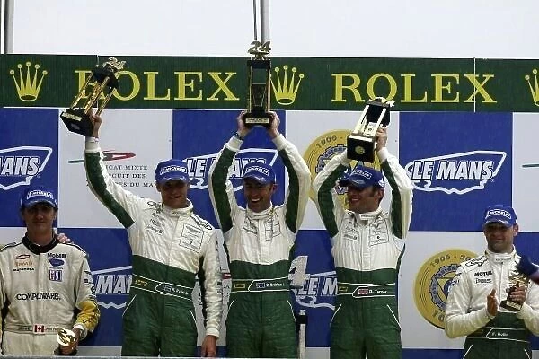 2007 Le Mans 24 Hours. Le Mans, France. 13th - 17th June. Race. David Brabham (AUS) /  Rickard Rydell (SWE) /  Darren Turner (GBR) (no 009 Aston Martin DBR9) celebrate victory on the podium. World Copyright: Kevin Wood / LAT Photographic