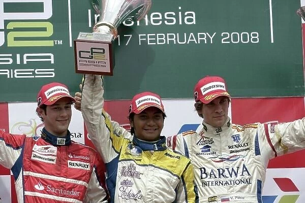 2008 GP2 Asia Series. Sunday Race. Round 2 - Sentul International Circuit, Indonesia. Sunday 17th February. Fairuz Fauzy, (MAL, Super Nova Racing) celebrates victory on the podium with Bruno Senna (BRA, iSport International) and Vitaly Petrov (RUS)