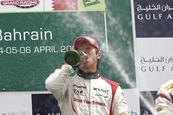 2008 GP2 Asia Series. Sunday Race. Bahrain International Circuit. Sakhir, Bahrain. 6th April. Kamui Kobayashi (JPN, Dams) celebrates his victory on the podium. World Copyright: Andrew Ferraro / GP2 Series Media Service. Service ref:__H0Y3363.jpg