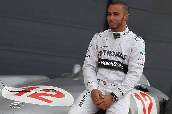2013 British Grand Prix- Preview Photo Call, Silverstone, Northants, 31st May 2013, Lewis Hamilton (GBR) sits on the Mercedes-Benz W196, World Copyright: Jakob Ebrey / LAT Photographic
