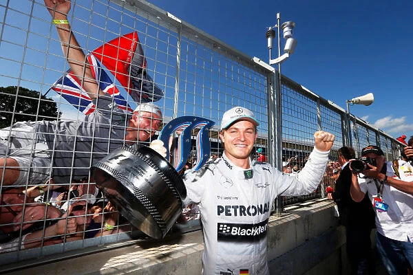 2013 British Grand Prix - Sunday: Nico Rosberg, Mercedes AMG, 1st position, shows his trophy to the crowd