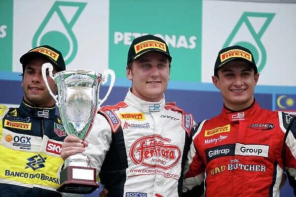 2013 GP2 Series. Round 1. Sepang, Kuala Lumpur, Malaysia. 24th March 2013. Sunday Race. Stefano Coletti (MON, Rapax) celebrates his victory on the podium with Felipe Nasr (BRA, Carlin) and Mitch Evans (NZL, Arden International)