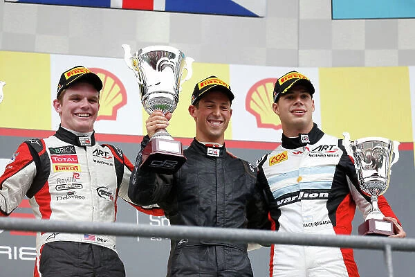 2013 GP3 Series. Round 6. Spa - Francorchamps, Spa, Belgium. 25th August. Sunday Race. Alexander Sims (GBR, Carlin) celebrates his victory on the podium with Conor Daly (USA, ART Grand Prix) and Facu Regalia (ARG, ART Grand Prix)