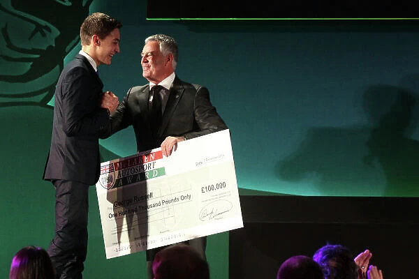 2014 BRDC Annual Awards The Grand Connaught Rooms, London, UK Monday 8 December 2014. George Russel accepts his prize money from Derek Warwick after winning the McLaren Autosport BRDC Young Driver Award. World Copyright: Ebrey / LAT Photographic