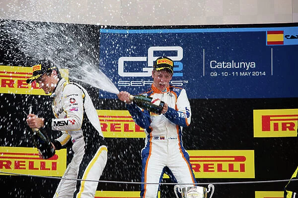 2014 GP2 Series Round 2 - Race 1. Circuit de Catalunya, Barcelona, Spain. Saturday 10 May 2014. Johnny Cecotto (VEN, Trident) & Jolyon Palmer (GBR, DAMS) spray champagne Photo: Malcolm Griffiths / GP2 Series Media Service