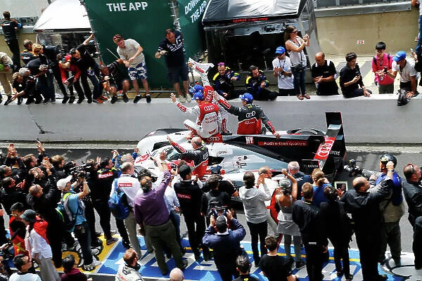 2014 Le Mans 24 Hours. Circuit de la Sarthe, Le Mans, France. Sunday 15 June 2014. The Audis make there way to the winners podium. World Copyright:Adam Warner / LAT Photographic. ref: Digital Image _L5R3156