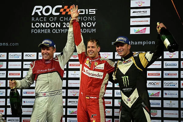 2015 Race Of Champions Olympic Stadium, London, UK Saturday 21 November 2015 Sebastian Vettel (GER) celebrates after winning the Race of Champions with Tom Kristensen (DMK) and Petter Solberg (NOR) Copyright Free FOR EDITORIAL USE ONLY