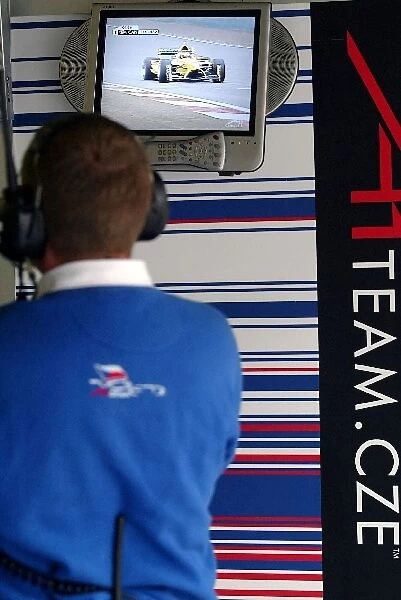 A1 Grand Prix: An A1 Team Czech Republic mechanic watches qualifying unfold on his monitor