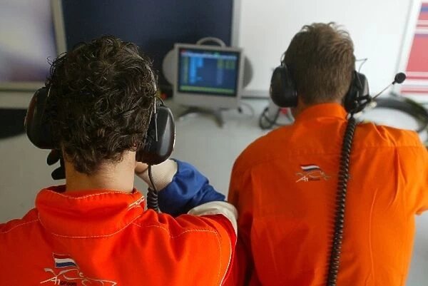 A1 Grand Prix: Two A1 Team Netherlands mechanics watch qualifying unfold on their screens
