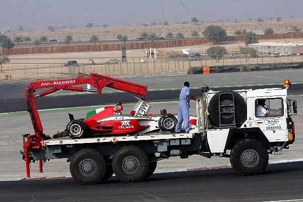A1 Grand Prix: The car of Salvador Duran A1 Team Mexico is returned to the pits on a truck after a crash in qualifying