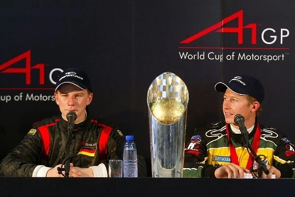 A1GP: Nico Hulkenberg A1 Team Germany with his big trophy out and Ryan Briscoe A1 Team Australia in the post race press conference