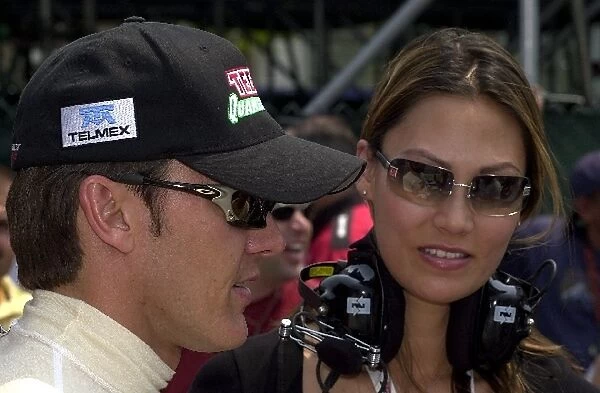 Adrian Fernandez and girlfriend talk to the press before qualifying for the Molson Indy Toronto